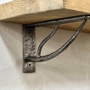 Wrought iron shelf brackets. Shelves storage.