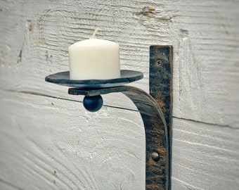 Wrought iron candle wall sconce. Iron wall candle holder. Ideal for interior design. Wall decor.