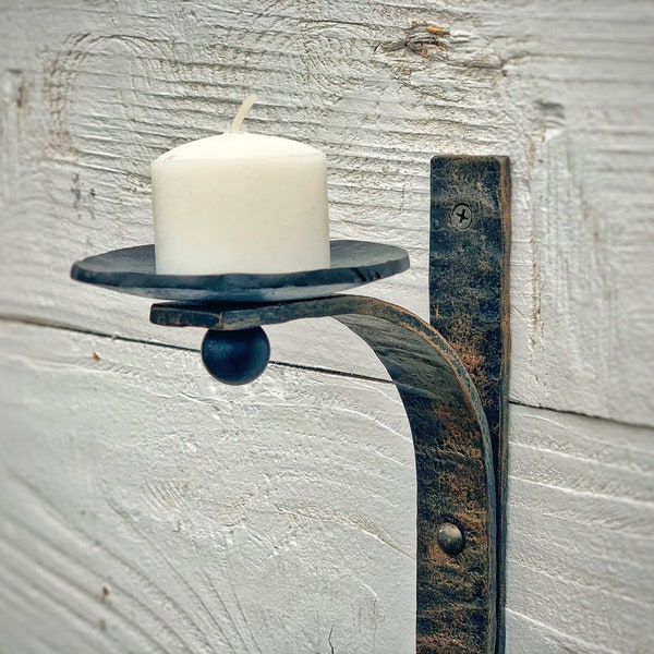 Wrought iron candle wall sconce. Iron wall candle holder. Ideal for interior design. Wall decor.