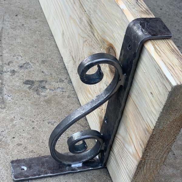 Hand forged metal shelf bracket. Shelves storage.