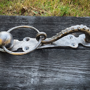 Wrought iron octopus door knocker.