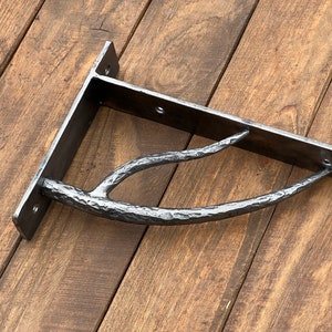 Hand forged metal shelf bracket. Shelves storage.