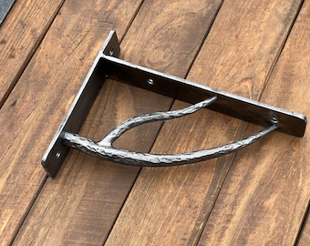 Hand forged metal shelf bracket. Shelves storage.