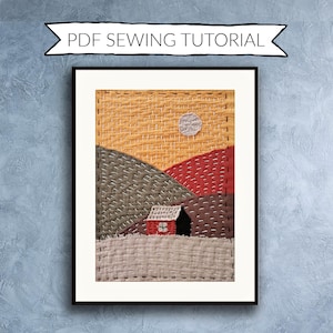 May include: Framed textile art showing a landscape with a house, hills, and a moon. The artwork features a red and black house, grey and red hills, and a yellow and orange sky. The text "PDF SEWING TUTORIAL" is above the frame.