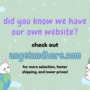 May include: A pastel green background with white clouds and stars. The text "did you know we have our own website? check out angelandhare.com for more selection, faster shipping, and lower prices!" is written in purple. Two white bunnies are on either side of the text. The bunny on the left is sitting on a blue and green globe. The bunny on the right is sitting on a white cloud.