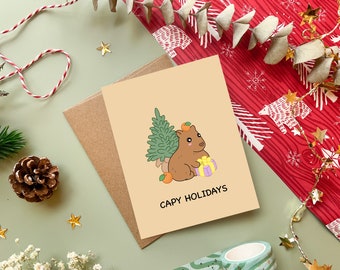 Capy Holidays | Cute Capybara Christmas Card Happy Holiday Cards Funny Pun Greeting Card Xmas Gift Kawaii Animal Cards | Angel + Hare