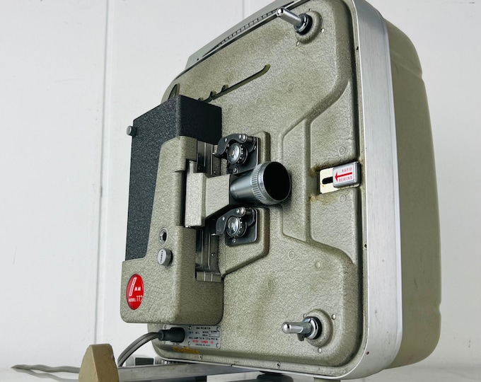 Featured listing image: Revere 777 8mm Film Projector, 1950s Grey Green Home Movie, Collectible, for Display, Decor