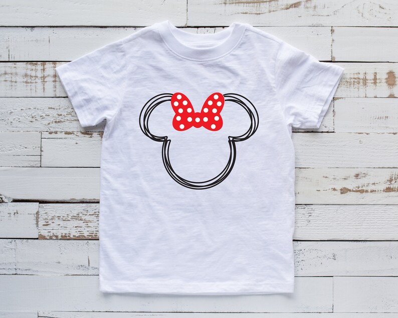 May include: White t-shirt with a black and white outline of Mickey Mouse's head with a red bow with white polka dots.