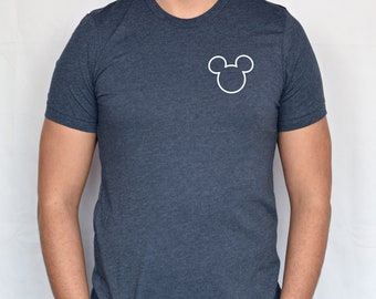 May include: A dark blue t-shirt with a white outline of Mickey Mouse's head on the left chest.