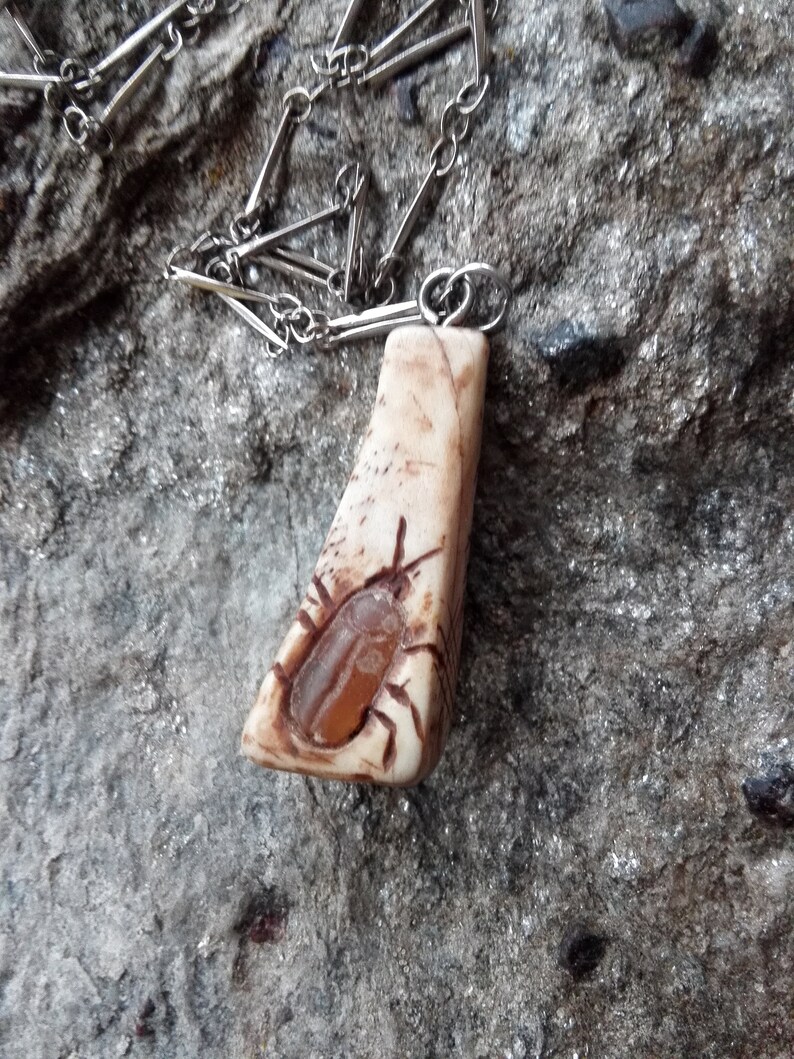 Chain pendant with Netsuke-style inlays