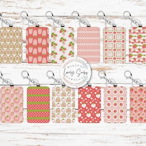 May include: Ten printable designs for keychains featuring various patterns with strawberries and pink, green, and white colors. The designs include strawberries, polka dots, stripes, and rainbows.