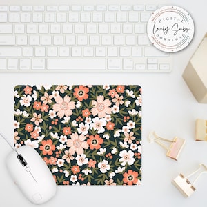 May include: A floral mousepad with a dark background and a pattern of peach, white, and orange flowers. A white computer mouse is connected to the mousepad. The text "DIGITAL LOVELY SUBS DOWNLOAD" is on a round sticker.