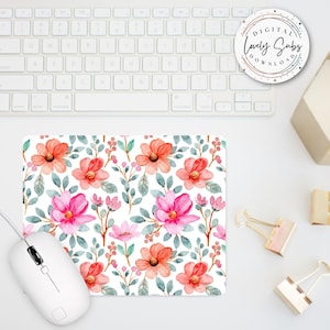 May include: A floral mousepad featuring a watercolor design of pink and orange flowers with green leaves on a white background. A white computer mouse is connected to the mousepad. The text "DIGITAL LOVELY SUBS DOWNLOAD" is on a round sticker.