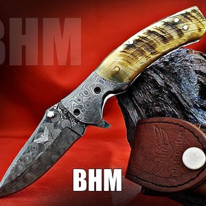 Handmade Damascus Folding Knife: Ram Horn Handle, Raindrop Blade