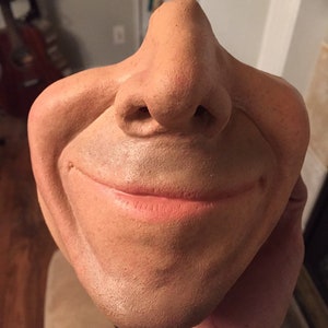 Smile mask. Made of latex. optional facial hair.