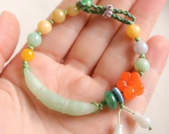 Natural Jade Lotus and Jade flower beads Bracelet. Hand carved with natural stone and categorized as Type A.
