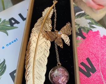 Gold metal feather bookmark with butterfly and flower pendant, teacher gift, bookish gift, book art, feather bookmark, book lover gift