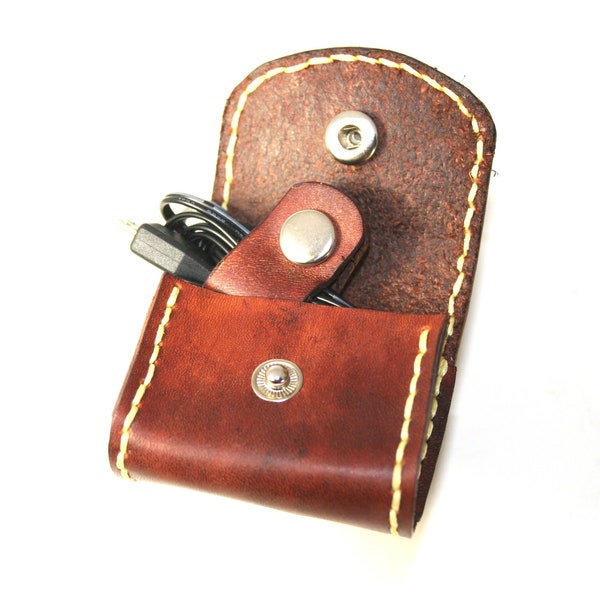 Mini leather pouch with cord tie.  For charger cord, earphones