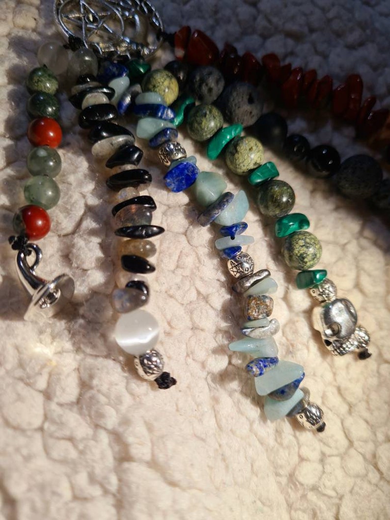 12 Stones Witchy key chain with witch hat tree of life scull cauldron charms and healing stones and its powerful energies pentagram