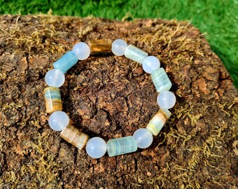 Pulsera curativa de calcita acuatina lemuriana azul con ágata blanca