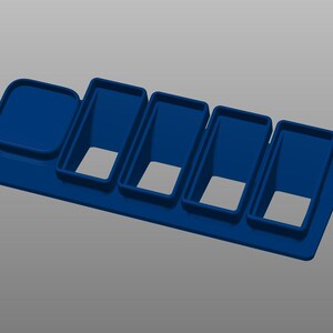 May include: A blue plastic organiser with six compartments. The organiser is designed to hold small items, such as pens, pencils, or other office supplies.