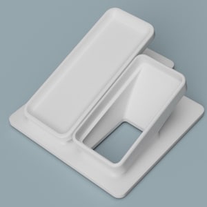 May include: White plastic phone stand with two slots, one for a phone and one for a charging cable.