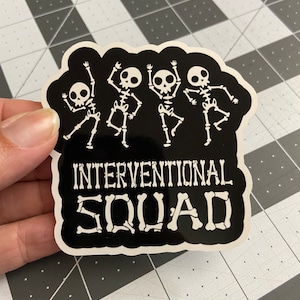 May include: Black and white sticker with four dancing skeletons and the text "INTERVENTIONAL SQUAD" in white letters.