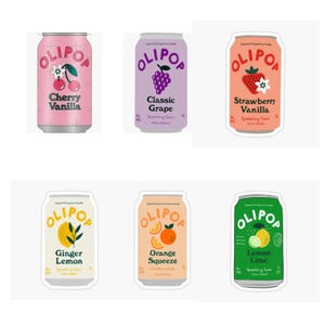 May include: Six cans of Olipop sparkling tonic in various flavors. The flavors include Cherry Vanilla, Classic Grape, Strawberry Vanilla, Ginger Lemon, Orange Squeeze, and Lemon Lime. Each can features a unique design with fruit illustrations and flavor names.