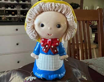 Girl Bank with a Bonnet, Yarn Hair, Blue Dress and Red Bow! Throwback to the 70s! Made of Paper Mache and Yarn!