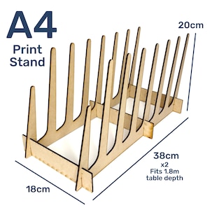 May include: A set of three ceramic vases in varying heights and shapes. The vases are glazed in a matte white finish, offering a minimalist aesthetic. The tallest vase is approximately 10 inches high.