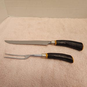 Westall Richardson, English made by Sheffield, stainless steel serving knife and fork set
