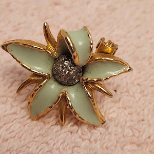 Enamel green and gold edelweiss flower brooch.
