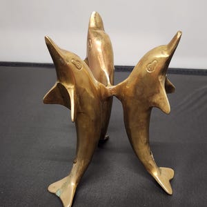 Dolphin trio candle holder/orb holder