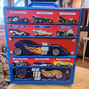 Vintage Hot Wheels Matchbox car collector case and 26 vintage vehicles.