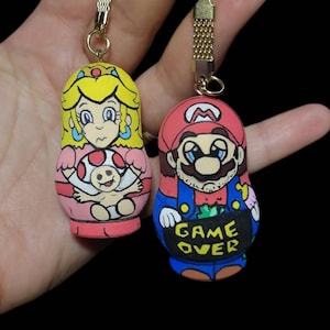 Hand painted wooden keyrings-Funny gift for New parents- Mario and the princess- Mini Art dolls- Matrioshka shape- Quirky and unique
