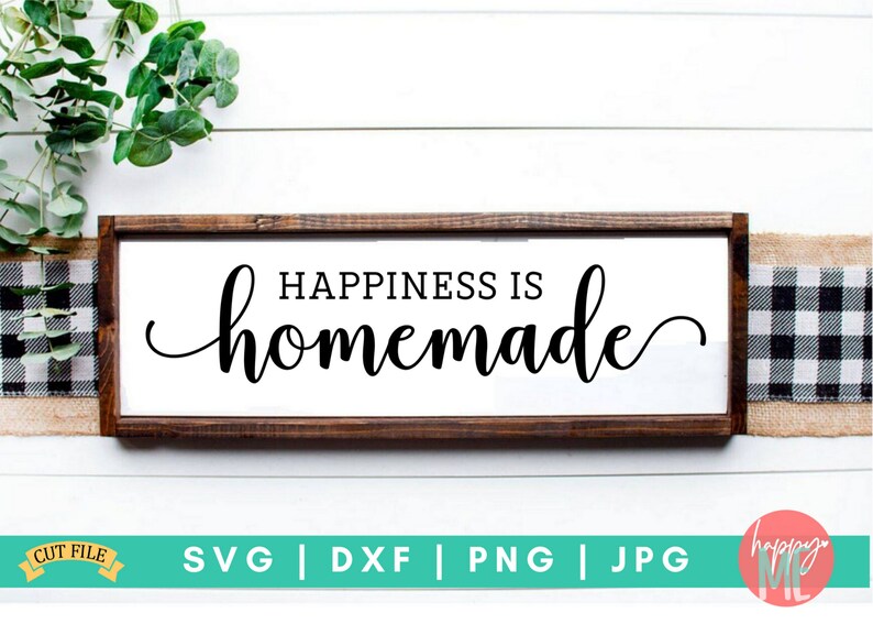 May include: A wooden sign with a white background and black text that reads "Happiness is homemade".