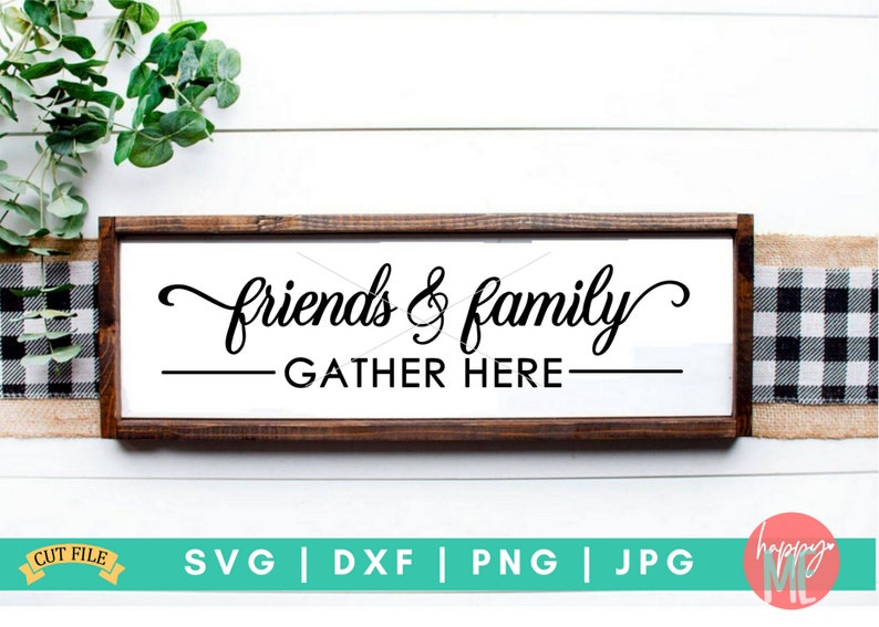 May include: A wooden sign with the text "friends & family gather here" in black script font. The sign is on a white background with a checkered pattern and greenery.