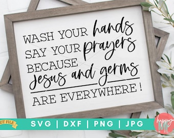 May include: A white sign with black text that reads "Wash your hands, say your prayers because Jesus and germs are everywhere!" The sign is framed in a light brown wood frame.