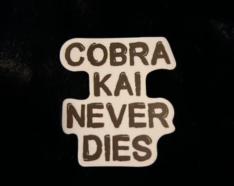 Cobra Kai never dies saying logo decal larusso macchio lawrence zabka series words scrapbook car book plastic sticker