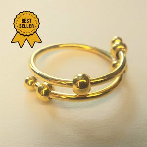 Anti Stress Ring mit beweglichen Perlen in Gold und Silber Bild 5
