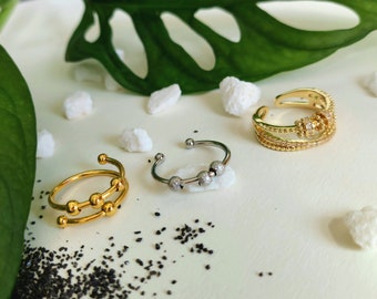 Anti Stress Ring mit beweglichen Perlen in Gold und Silber