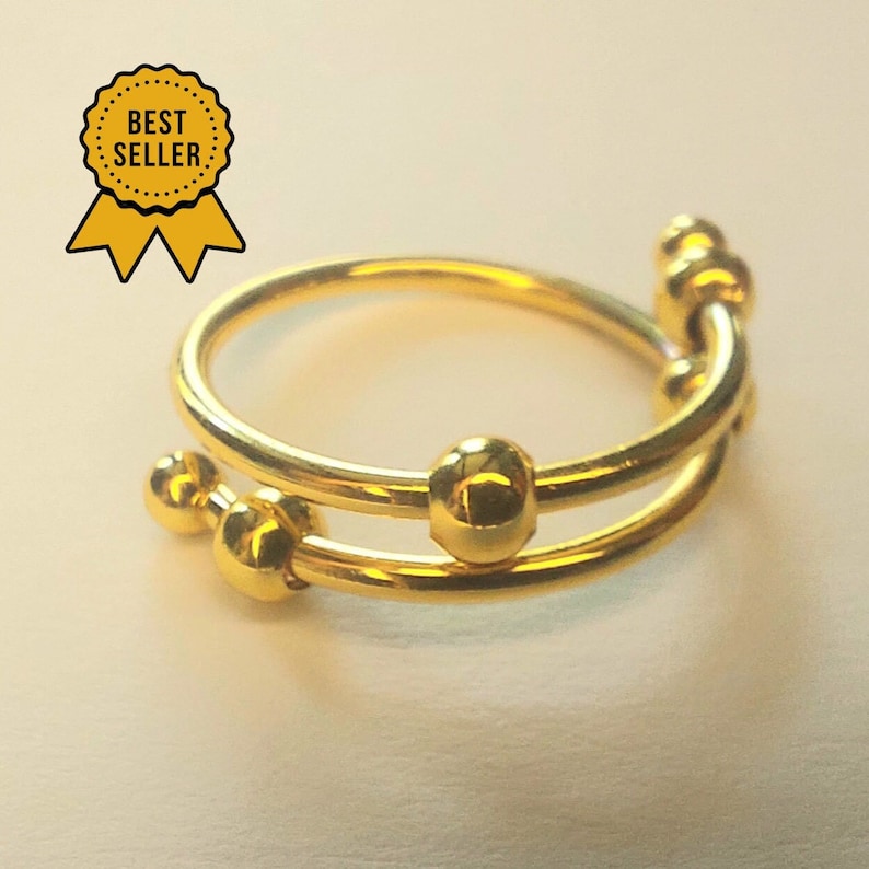 Anti Stress Ring mit beweglichen Perlen in Gold und Silber Bild 5