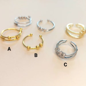 Anti Stress Ring mit beweglichen Perlen in Gold und Silber Bild 6