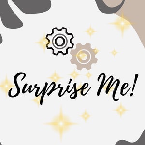 May include: A white background with grey and brown abstract shapes. The text "Surprise Me!" is written in black cursive font. Two gears are in the top left corner, one is black and white, the other is brown. There are gold stars scattered around the image.