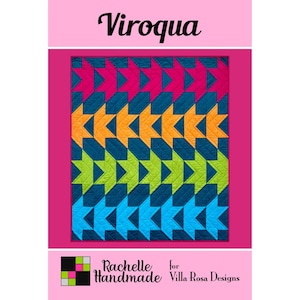 May include: A colorful quilt pattern with the word "Viroqua" at the top. The quilt features a repeating star design in shades of pink, orange, green, and blue against a dark blue background. The design is framed by a pink border.