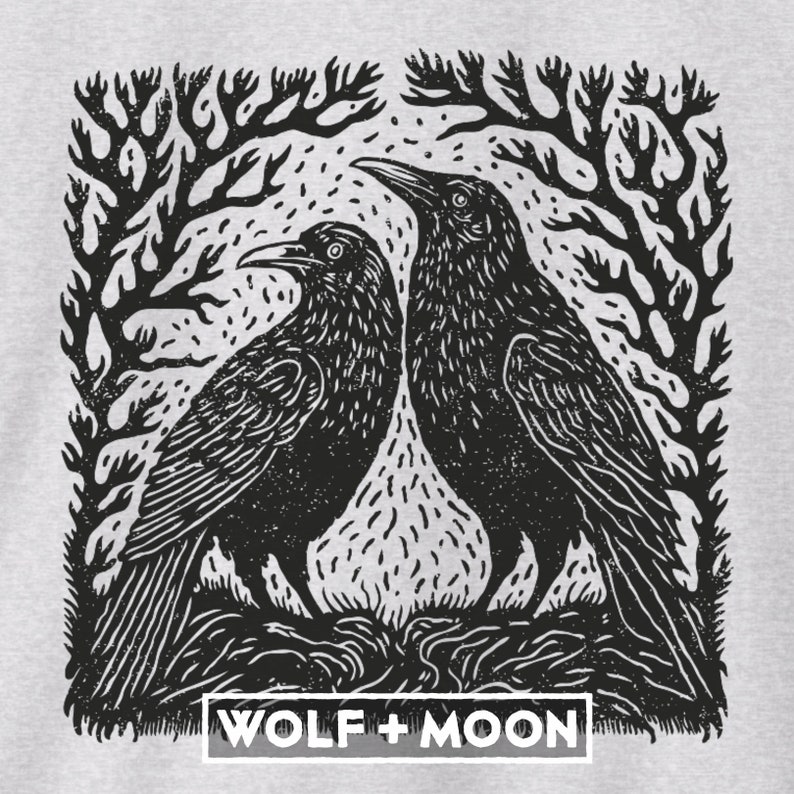 May include: Black and white illustration of two crows perched on a branch with the text "WOLF + MOON" below.