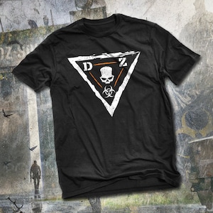 May include: Black t-shirt with a white triangle graphic featuring the letters "DZ" and a skull with biohazard symbols.