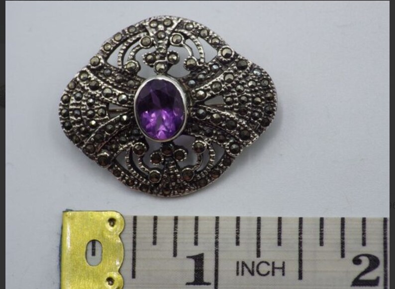 Vintage sterling and amethyst brooch