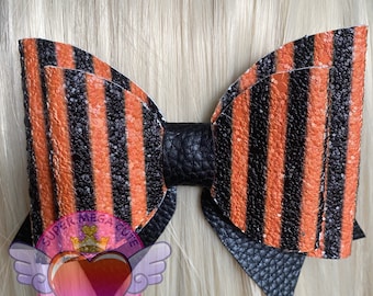 Lola bow .Orange and black stripe.