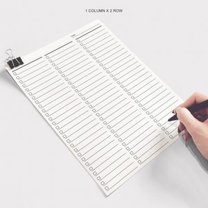 May include: A white checklist with two columns and 40 rows. Each row has a checkbox and a blank line for writing. The checklist is held by a binder clip and a hand is writing on the checklist with a red and black pen.
